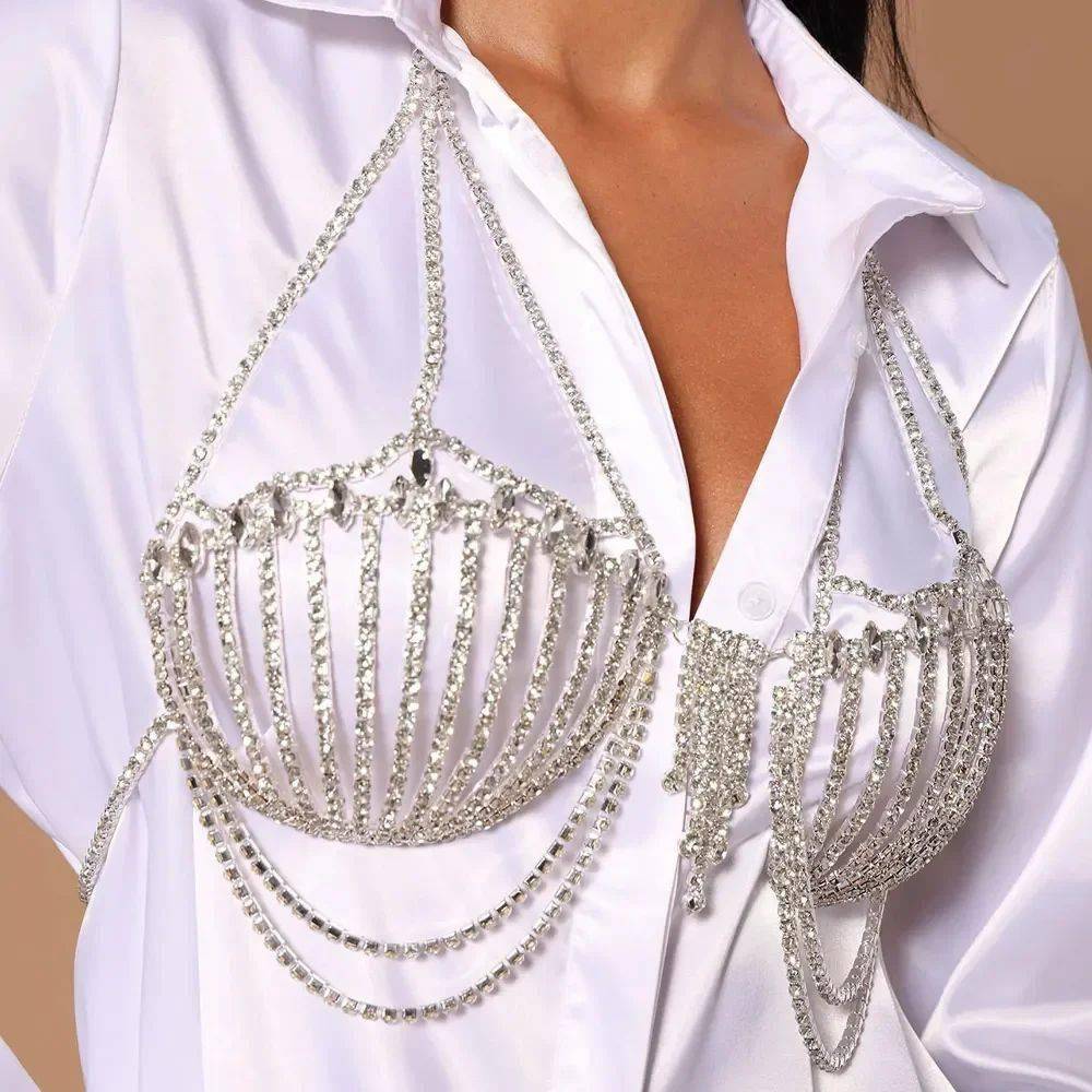 Turn heads with this stunning rhinestone bra chain dress – the ultimate festival and nightclub body jewelry top for women. Crafted with sparkling crystal rhinestones, this statement piece works as a daring bra top, chest accessory, or chain dress overlay. Perfect for EDM festivals, rave parties, beachwear, clubbing nights, and bold fashion shoots, it adds instant glamour and sparkle to any outfit. Lightweight and adjustable, this crystal body jewelry gives you the perfect fit while making you shine under every light.